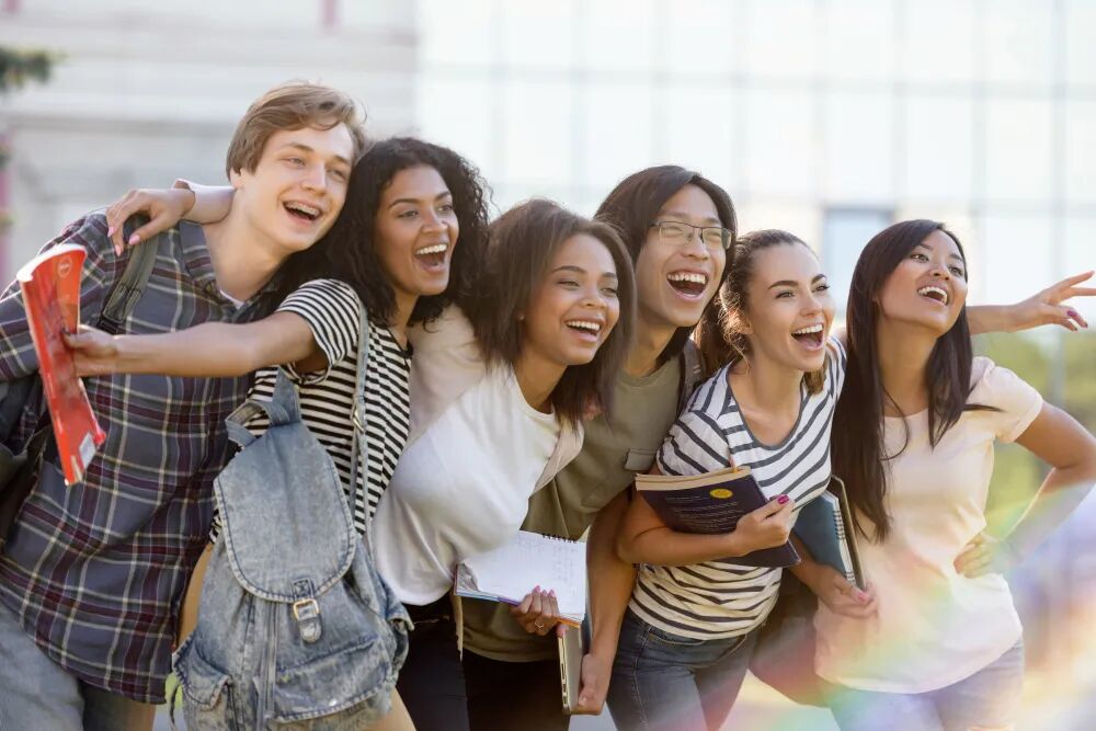 multiethnic-group-young-happy-students-standing-outdoors.jpg